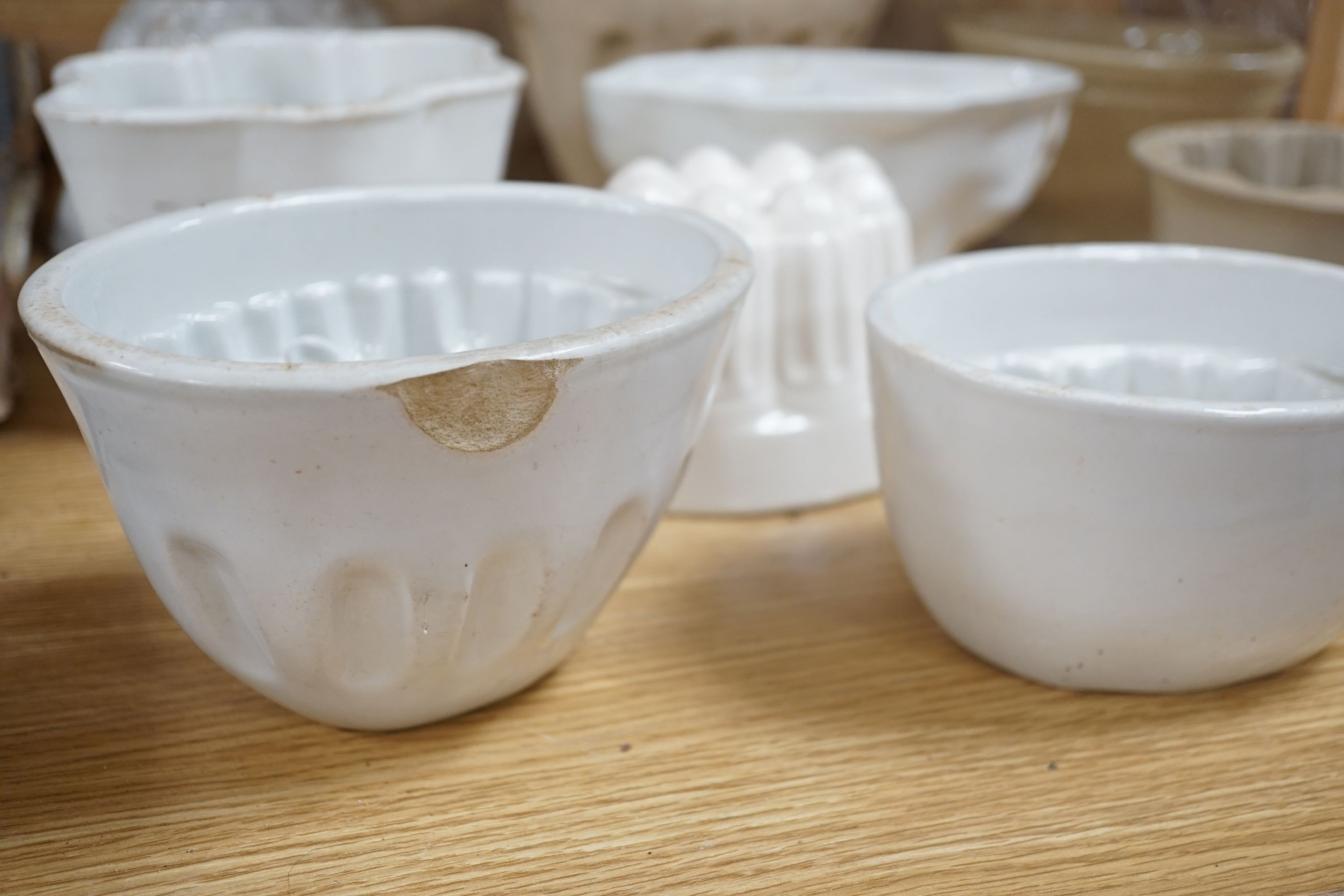 A collection of thirteen various sized 19th and 20th century ceramic jelly moulds